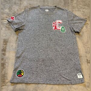 Roots Heather Gray Graphic Tee with Red and Green Accents